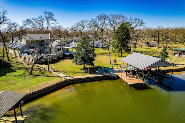 dock area featuring a yard and a water view