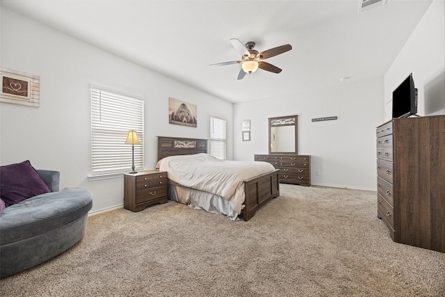 bedroom featuring light carpet and ceiling fan