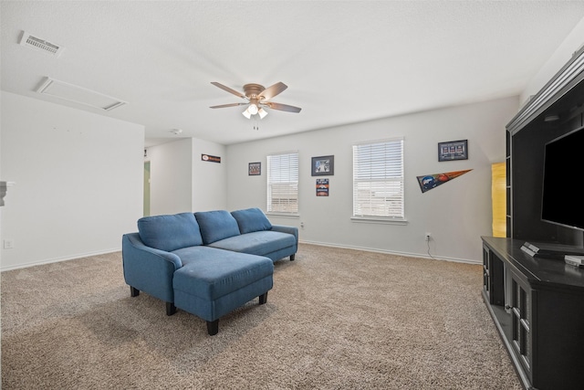 living room featuring ceiling fan and carpet flooring