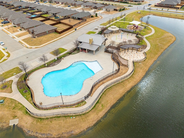 view of pool with a water view