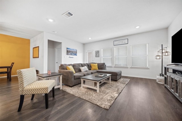 living room with dark hardwood / wood-style floors