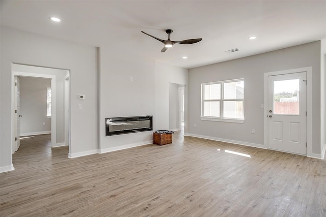 2604 Creekview Dr, Granbury, TX 76048 - unfurnished living room with a ceiling fan, light wood-type flooring, baseboards, and recessed lighting
