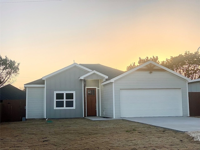 2604 Creekview Dr, Granbury, TX 76048 - ranch-style house with board and batten siding, driveway, and a garage