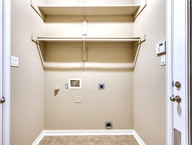 washroom with washer hookup, light tile patterned floors, hookup for a gas dryer, and hookup for an electric dryer