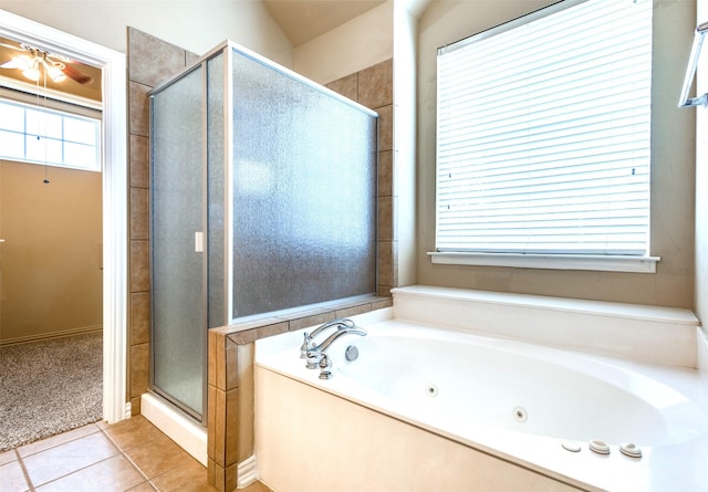 bathroom with tile patterned floors and shower with separate bathtub