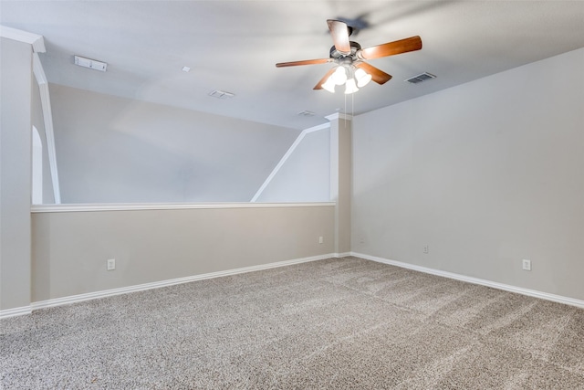 carpeted spare room with ceiling fan