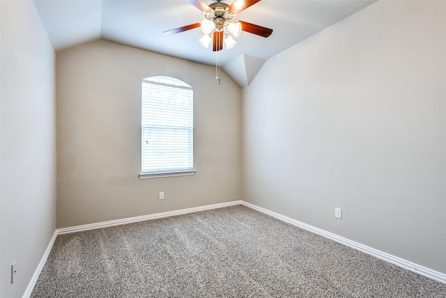 spare room with lofted ceiling, carpet floors, and ceiling fan