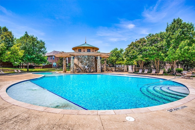 view of swimming pool featuring a patio area