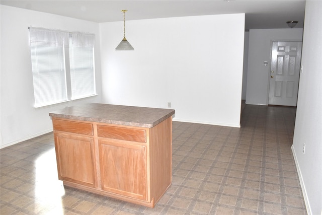 kitchen featuring pendant lighting and a center island