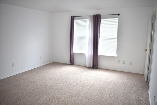 empty room with light colored carpet