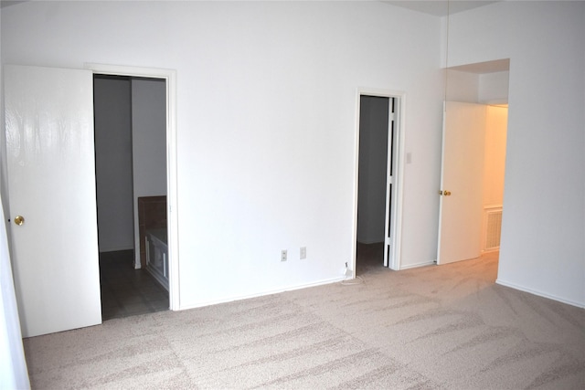 empty room with light colored carpet