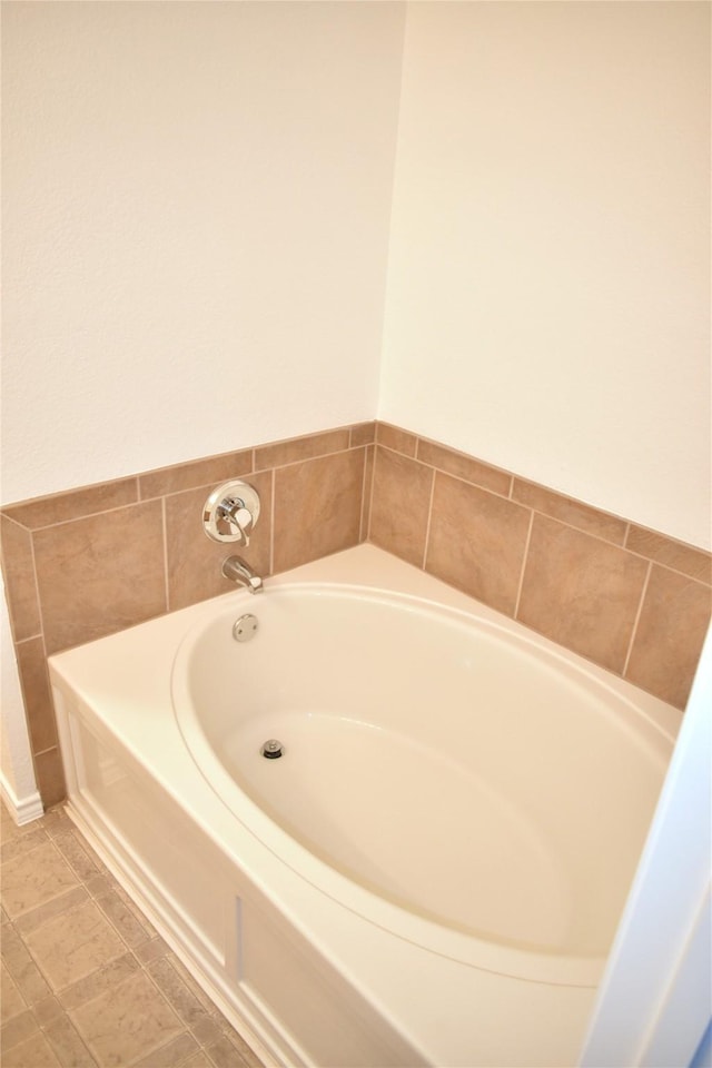 bathroom featuring a tub to relax in