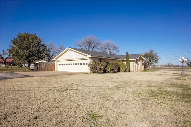 view of front of home with a garage and a front yard