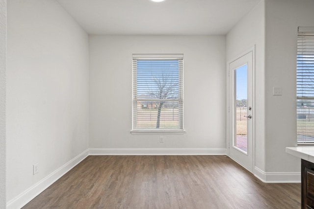 spare room with dark wood-type flooring