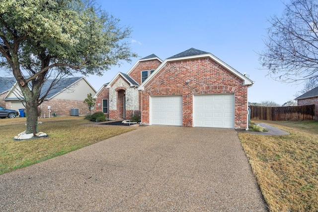 view of front property with a garage and a front yard