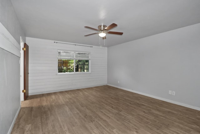 unfurnished room featuring hardwood / wood-style flooring and ceiling fan