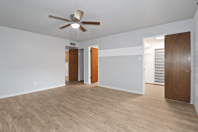 spare room featuring ceiling fan and light hardwood / wood-style floors