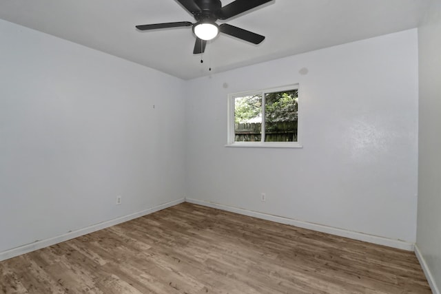 empty room featuring wood-type flooring and ceiling fan