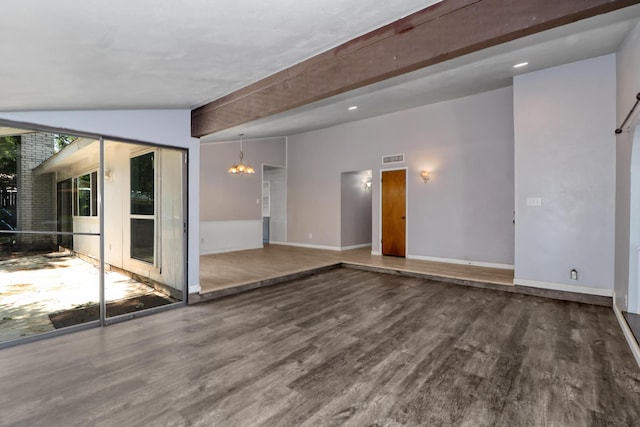 spare room with wood-type flooring, vaulted ceiling with beams, and a notable chandelier