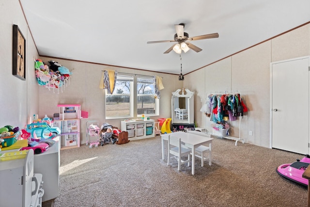 rec room with ceiling fan, ornamental molding, and carpet floors