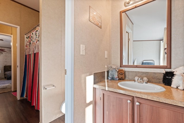 bathroom with hardwood / wood-style flooring and vanity