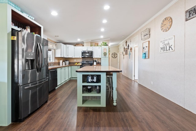 kitchen with crown molding, stainless steel appliances, a kitchen island, and white cabinets