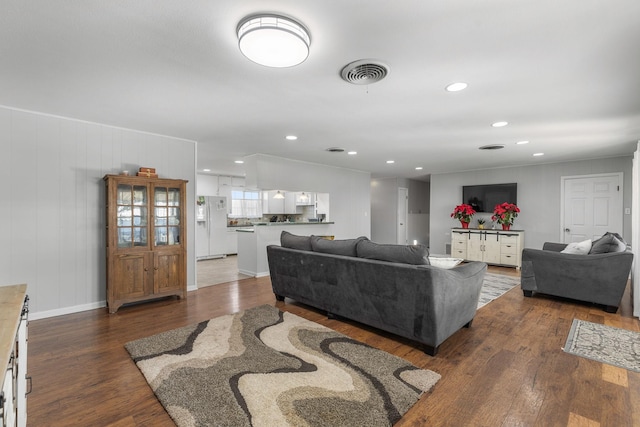 living room featuring dark wood-type flooring