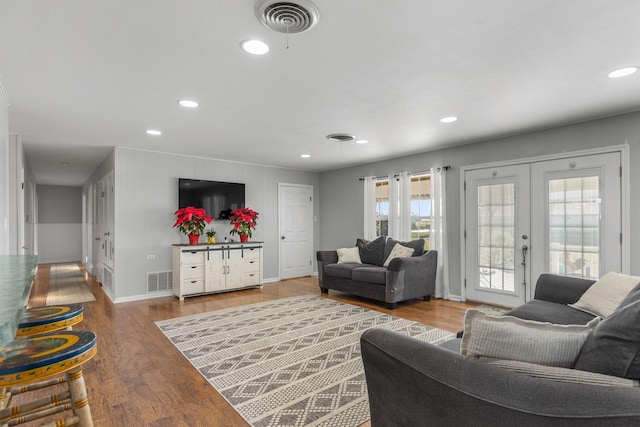 living room featuring hardwood / wood-style floors and french doors