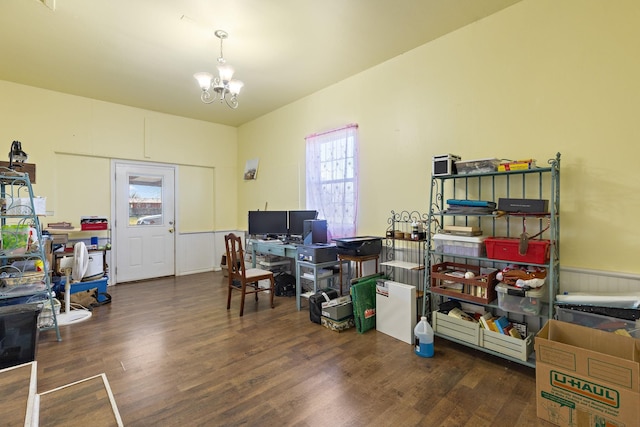 office area with dark hardwood / wood-style floors and a notable chandelier