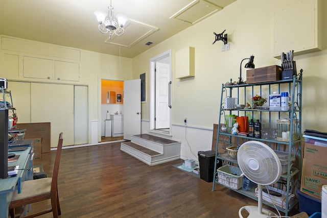 misc room with dark hardwood / wood-style flooring and an inviting chandelier