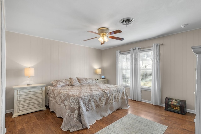 bedroom featuring hardwood / wood-style floors and ceiling fan