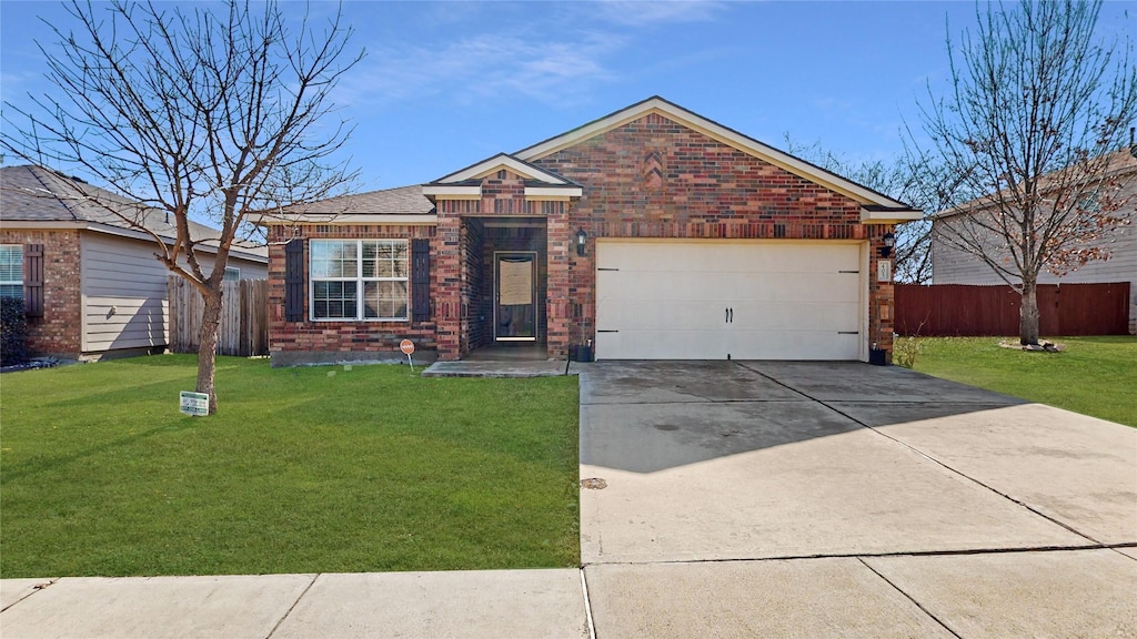 ranch-style house featuring a garage and a front yard