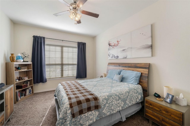 bedroom with dark colored carpet and ceiling fan