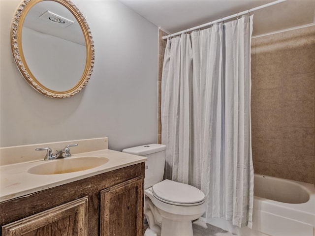 full bathroom featuring vanity, shower / tub combo with curtain, and toilet