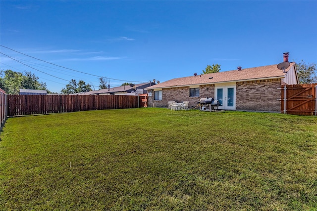 view of yard with french doors