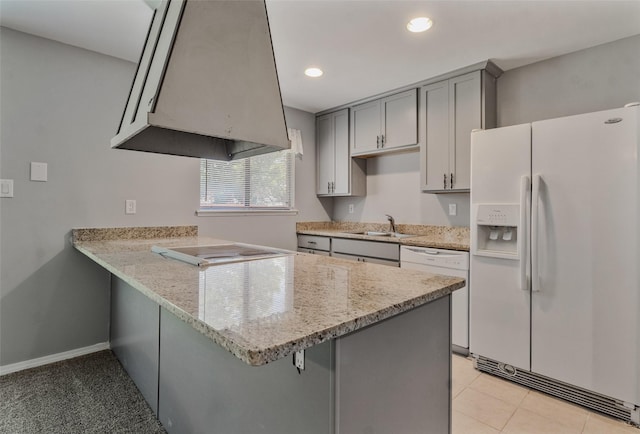 kitchen featuring sink, gray cabinetry, white appliances, and kitchen peninsula