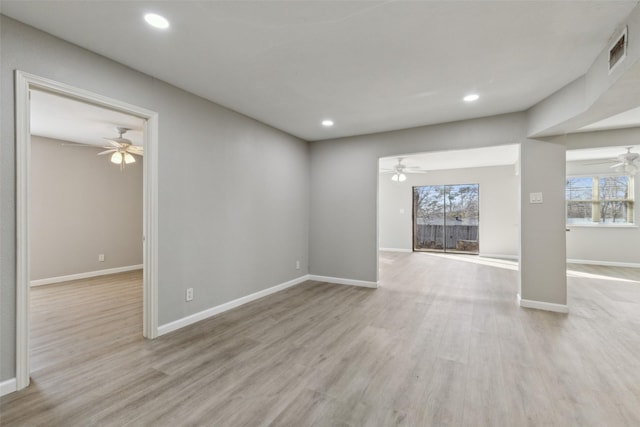 unfurnished living room featuring ceiling fan and light hardwood / wood-style floors