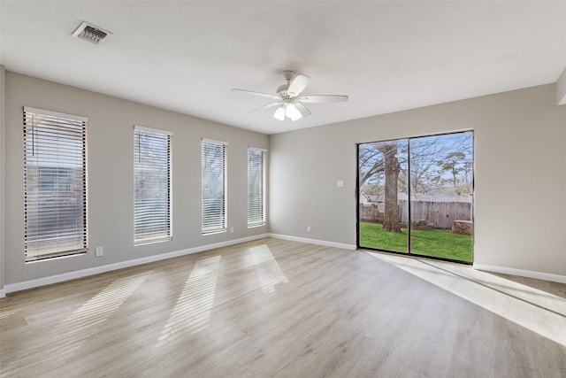 unfurnished room with ceiling fan and light hardwood / wood-style floors