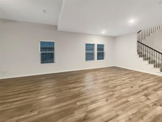 unfurnished living room with hardwood / wood-style flooring