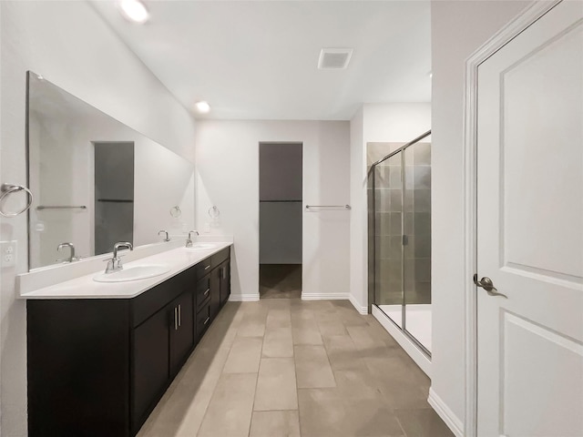 bathroom featuring vanity and an enclosed shower