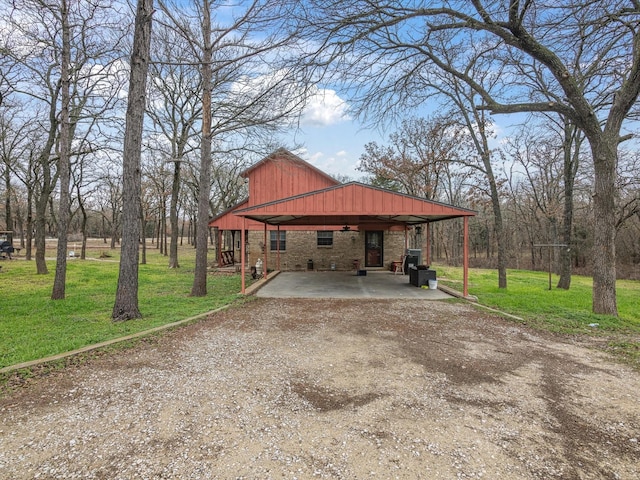 view of side of property with a yard and a carport