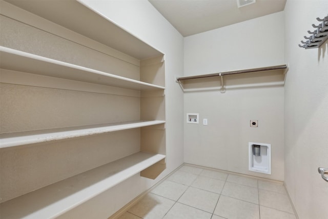 laundry room featuring hookup for a washing machine, tile patterned flooring, and hookup for an electric dryer