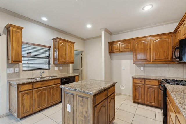 kitchen featuring a kitchen island, sink, light tile patterned floors, light stone counters, and black appliances