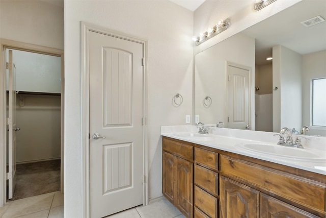 bathroom featuring vanity and tile patterned flooring