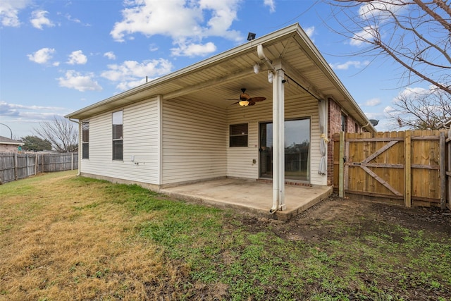 back of property featuring a patio, a yard, and ceiling fan