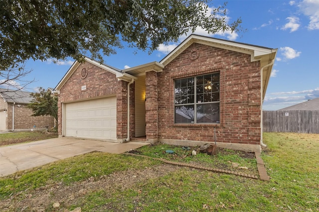 view of front of house featuring a garage and a front lawn