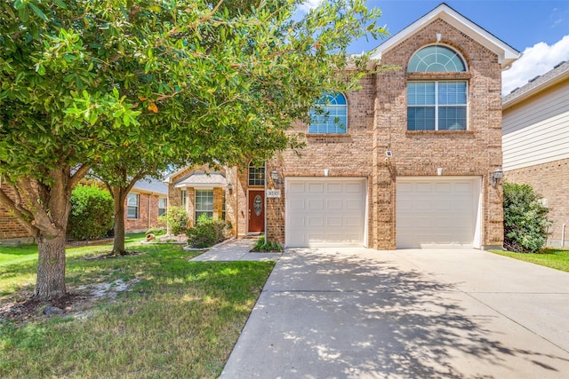 view of front of house featuring a garage and a front yard