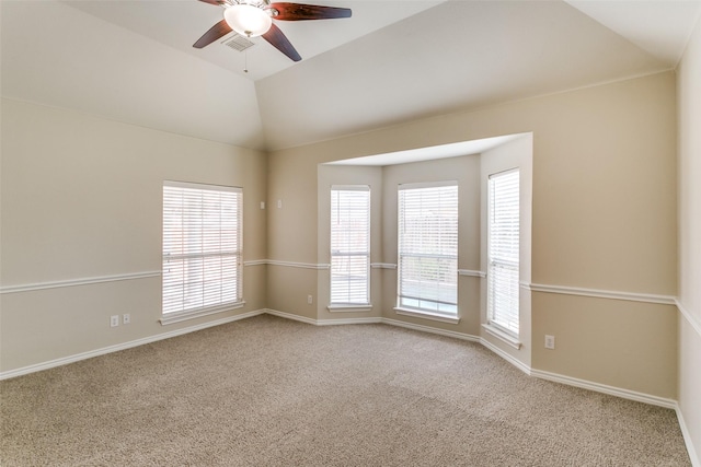 unfurnished room with vaulted ceiling, light carpet, and ceiling fan