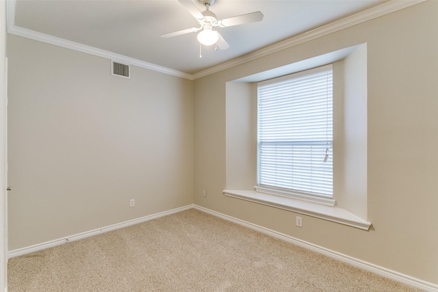 carpeted empty room featuring crown molding and ceiling fan