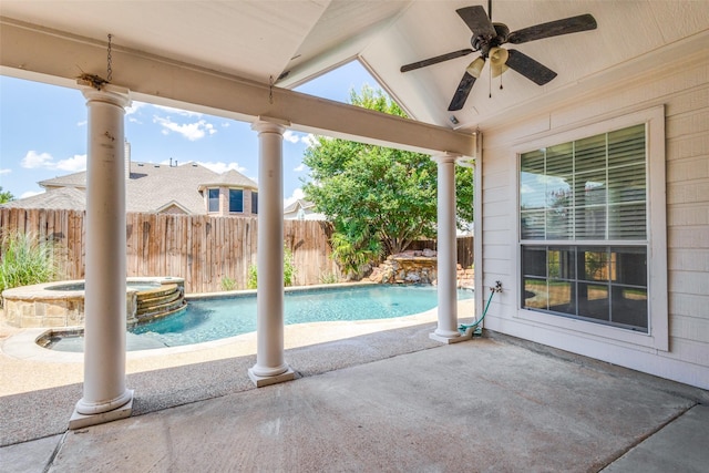 view of swimming pool featuring a patio area, pool water feature, ceiling fan, and an in ground hot tub